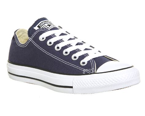 navy blue converse low tops.